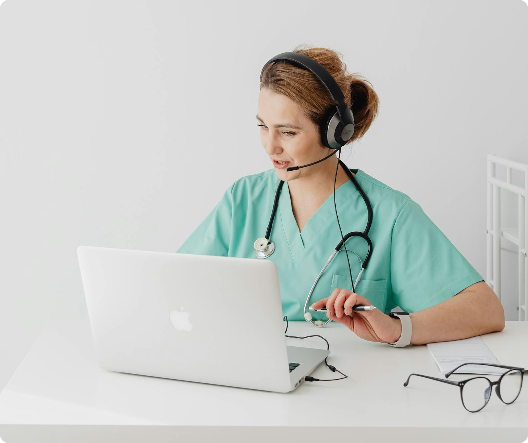 Medical professional in scrubs using a laptop next to text about "Medical SEO Services for Healthcare Practices."