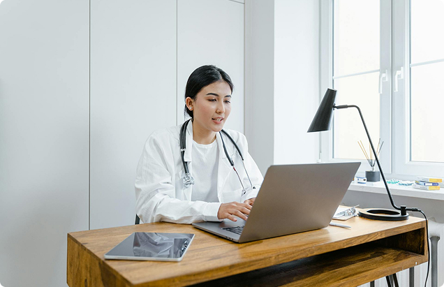 A high-resolution desktop monitor displaying a professional medical website designed by Best Edge Medical Marketing, featuring a doctor and healthcare services.